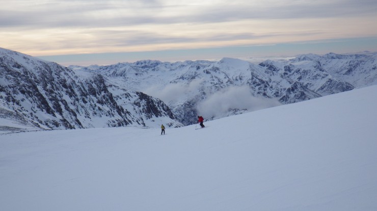Skiing down to the Aonach mor/Beag col with the Mamoares and Glen Coe hills behind. Again rather firm. 