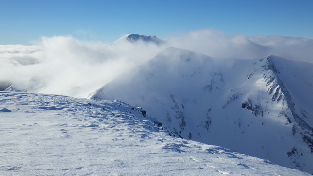Carn Mor Dearg and Ben Nevis poking out above the cloud. 