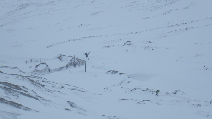 A lone walker above the hut. 