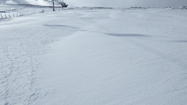 Clear contrast between scoured old snow (on left) and the recent windslab
