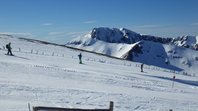 Skiing and boarding at Nevis Range with Ben Nevis behind.