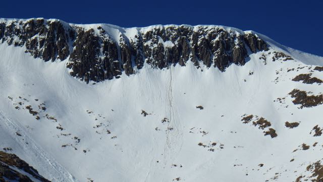 Cornice collapse and snow dropping off warming rock in Coire an Lochan.