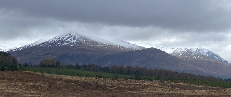 Looking up to Aonach Mor, Carn Mor Dearg, and Ben Nevis in the background.
